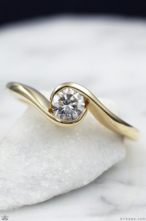 This affordable custom engagement ring gently flows around the diamond like waves on a beach.  What colors do you like?  How about Rose Gold with a Champagne Diamond? Carved Gold Engagement Ring, Single Diamond Gold Ring, Wave Engagement Ring, Single Stone Gold Ring, Single Stone Rings Gold, Elegant Engagement Rings Gold, Stone Ring Design Gold, Modern Ring Settings, Flat Engagement Ring