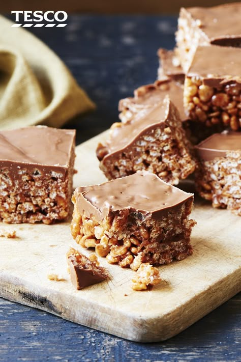 Kids and adults alike will love this chocolate rice crispy cakes recipe. These quick and easy chocolate crispy treats are perfect for cooking with kids and enjoying as an easy chocolate snack. | Tesco Chocolate Rice Krispie Cakes, Chocolate Rice Crispy Cakes, Chocolate Crispy Cakes, Chocolate Crispy Treats, Crispy Cakes, Rice Crispy Cake, Chocolate Rice Crispy, Chocolate Rice Cakes, Rice Krispie Cakes