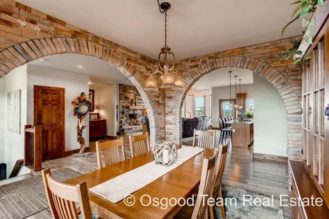 Formal dining room archway brick Arch Archways In Homes, Airplane Hangar, Brick Archway, Stone Archway, Brick Arch, Beautiful Dining Rooms, Walk Out, Fenced In Yard, Formal Dining Room