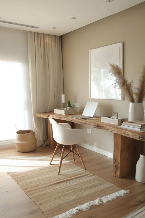 A minimalist home office focuses on simplicity and function, removing unnecessary clutter. Click for more ideas. Home Office Boho Chic Bohemian, Small Rustic Office Ideas, Home Office Organic Modern, Home Office And Sitting Room Combo, Natural Desk Setup, Neutral Boho Office, Small Home Office Organization Ideas, Small Minimalist Office, Boho Minimalist Office