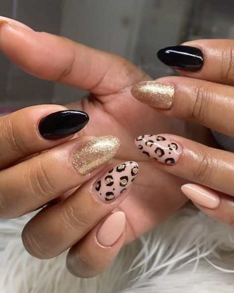 Nude, gold, and black nail colors with leopard print nail art on medium almond nails Chitah Print Nails, Almond Nails Designs Cheetah, Leopard Print Nails Almond Shape, Lepord Print Nail Design, Chetta Print Nail, Fall Cheetah Print Nails, Leapord Print Nail Art, Almond Shaped Nails Designs Fall, Almond Nails Leopard