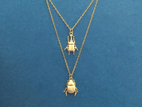 "Beetle necklace set, Gold Beetle necklace, 14K gold necklace, Pendant necklace, Christmas gift, Girl friend gift, Bridesmaid gift How to order You can choose single beetle A necklace only, beetle B only, or Set of 2(beetle A+B) necklaces at discount price at checkout Item details ♥ Color: gold, silver ♥ Pendant material: brass, gold plated ♥ Length: 15-19\" ♥ Chain & clasp material: gold plated chain ♥ You can choose your necklace type when you check out  WHAT ARE BENEFITS OF GLIGET JEWELRY - H Christmas Gift Set, Brass Pendant Locket Charm Necklace, Friend Christmas Gifts, Beetle Jewelry, Different Bugs Jewelry, Beetle Necklace, Insect Jewelry Necklaces, Bee Pendant Necklace, Gold Necklace Set