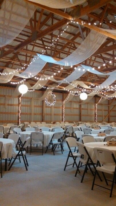 Shop Wedding Reception Decor, Metal Building Wedding Reception, Wedding Shed Decorations, Simple Wedding Ceiling Decorations, Wedding Reception In Garage, Garage Wedding Ideas, Boho April Wedding, Morton Building Wedding Reception, Metal Shop Wedding Reception