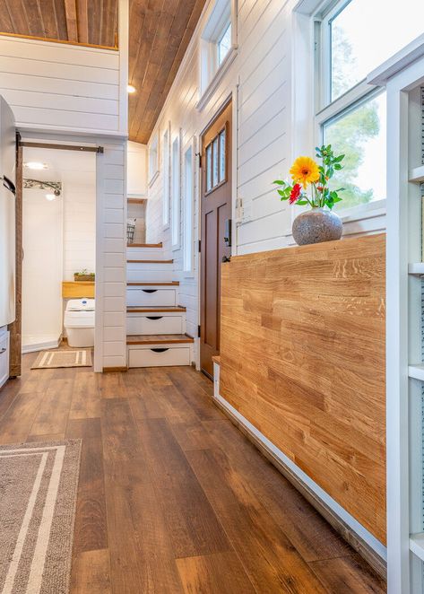 Inside Nicole's tiny house are warm wood floors and ceiling, along with white walls and cabinets. Gooseneck Tiny House, Tiny House Designs, Tiny House Builders, Small Tiny House, Tiny House Interior Design, Tiny House Layout, Tiny House Loft, Best Tiny House, House Loft