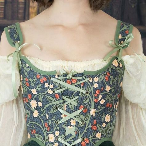 French Meadows Corsets on Instagram: "A Winter Fae🤍🧚 This corset fabric is new to the sh0p! Inspired by William Morris designs, this fabric has raspberry blossoms and fruit swirling around vines on a dark blue background. I personally love the green trim on this corset, which I think adds just a touch more whimsy to this already whimsical piece. * * * * * #corsetstyle #corset #stays #corsetry #historicalfashion #18thcenturyfashion #corsets #renaissancefestival #renaissancefaire #slowfashion #cottagecorestyle #cottagecorefashion #cottagecore #cottagecoreaesthetic #vintageinspired #fairytale #fairy #fairycore #hobbitcore #princesscoreaesthetic #williammorris" Renfaire Cottagecore Outfit, Whimsical Corset, Cottagecore Outfits Corset, Fairycore Corset Outfit, Fairycore Corset Dress For Cosplay, Hobbitcore Outfits, Fairy Core Corset, Fantasy Formal, Whimsy Fashion