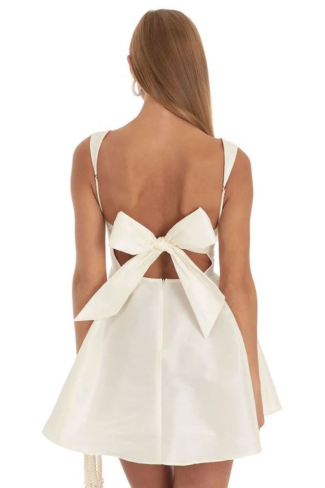 Cherley White Bow Tie Back Evening Dress, White Evening Dress With Bow Tie Back, A-line Mini Dress With Bow For Wedding, White Evening Dresses With Satin Bow, Cream Party Dress With Bow, Wedding A-line Mini Dress With Tie Back, White Dresses With Satin Bow For Spring, White Satin Bow Dress For Spring, White Spring Dresses With Satin Bow