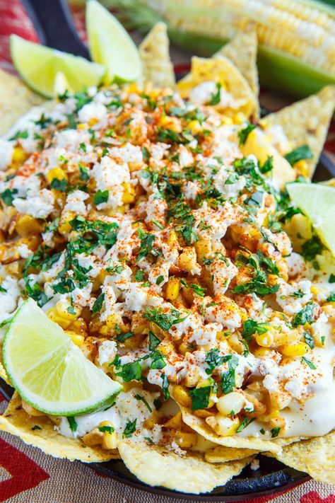 A recipe for Mexican Street Corn Nachos : All of the flavours of Mexican style street corn in nacho form with grilled or charred corn, mayo, feta, cilantro, cayenne and lime juice along with the nachos and a creamy melted Monterey Jack cheese sauce! Elote Nachos, Street Corn Nachos, Snacking Ideas, Corn Nachos, Mexican Party Food, Traditional Mexican Food, Mexican Appetizers, Authentic Mexican Recipes, Mexican Street Corn