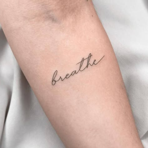 "Breathe" lettering tattoo on the inner forearm. Breathe Tattoos For Women, Just Breathe Tattoos For Women, Just Breathe Tattoos, Forearm Word Tattoo, Relax Tattoo, Tattoos For Women Forearm, Breathe Tattoos, Just Breathe Tattoo, Wrist Tattoos Words