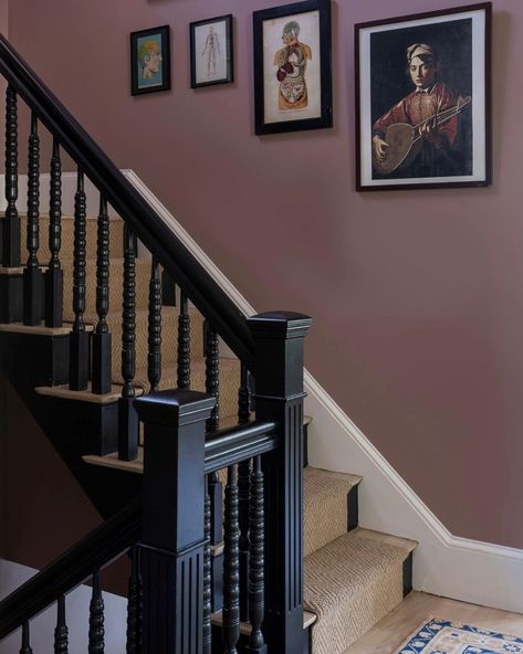 Moody and gorgeous in every light, the star of this space at our Chase Street Project is @farrowandball paint in Sulking Room Pink. Build: Design : @milkandhoneygroup Photo: @jessicadelaneyphotography #designer #design #gc #generalcontractor #newton #massachusetts #chasestreet #project #charming #staircase #victorian #milkandhoneygroup Sulking Room Pink Hallway, Butler Staircase, Burgundy Staircase, Lilac Hallway, Colour Drenched Hallway, Pink Hallways, Monochrome Staircase, Colored Staircase, Stairwell Paint Colors