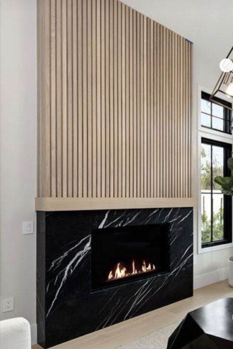 Modern Wood Burning Fireplace Natural, Fluted Wood Fireplace Wall, Ribbon Tile Fireplace, Vertical Wood Fireplace, Pole Wrap Fireplace, Mid Century Fireplace Ideas, Two Tone Fireplace, Wood Panel Fireplace, Modern Fireplace Mantle