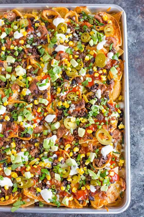 A sheet pan full of loaded nachos. Nacho Dips, Nachos In Oven, Nacho Bar Ideas, Best Nacho Recipe, Nacho Recipes, Brown Eyed Baker, Nachos Recipe Easy, Nacho Bar, Nacho Chips