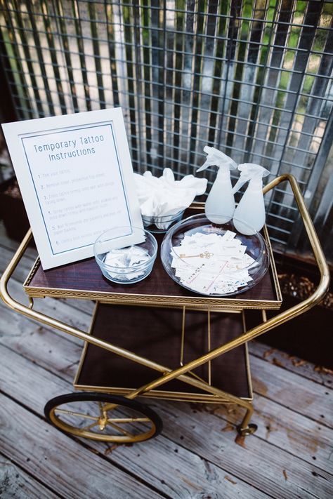 Wedding Ideas: Temporary Tattoo Station! Brass Mid-Century bar cart used for a fun temporary tattoo station at a wedding. Rentals by Birch & Brass Vintage Rentals. Temporary Tattoo Station, Tag Tattoo, Wedding Temporary Tattoos, Tattoo Table, Tattoo Bar, Party Stations, Tattoo Station, Bar Wedding, Wedding Activities