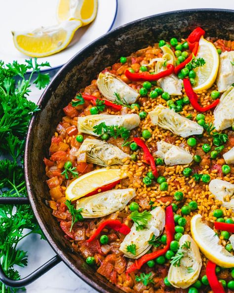 This vegetarian paella recipe is full of delicious, hearty flavor! A vegan spin on the classic Spanish recipe, it pleases everyone. #vegetarianpaella #veganpaella #vegetarian #paella #spanish #paellarecipe #vegetablepaella Vegetarian Paella, 500 Calories Recipes, Spanish Recipe, A Couple Cooks, Spanish Paella, Refreshing Salads, Weeknight Dinner Ideas, 500 Calorie, Paella Recipe