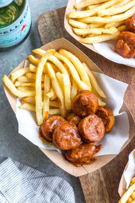 This homemade currywurst is a German street food staple. This version, while much like the traditional one, is sugar-free, Whole30 and paleo! You'll love it because it's such a burst of flavor, comforting, and cooks in under 30 minutes. It also only requires very few ingredients, making it perfect for lunch or an easy weeknight dinner recipe. #whole30germanrecipes #germanfood #whole30pork #paleopork #bratrecipes #lunchrecipes Fries And Sausage, Whole 30 Fast Food Options, Fries Food Photography, Whole 30 French Fries, Healthy French Fries Alternative, Yellow Curry Powder, German Bratwurst, Kaiser Roll, Burger Fries Photography