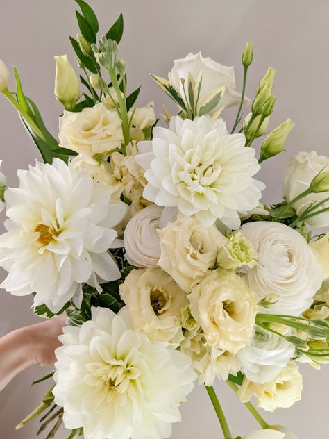 Light yellow dahlias, lisianthus and ranunculus in a spring bouquet Wedding Aisle Set Up, Dahlia Bride Bouquet, Yellow Wedding Bouquets, White And Yellow Bouquet, Yellow And White Wedding Flowers, Yellow And White Bouquet, White And Yellow Wedding Flowers, Yellow Wedding Decor, Lisianthus Boutonniere