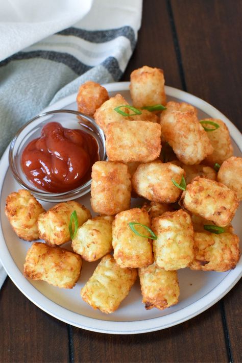 Air Fryer Frozen Potato Puffs are so crispy. Let me show you how to make tater tots in the air fryer including air fryer Alexia Potato Puffs! Air-fried tater tots is the best way and quickest way to make tater tots, but, if you don't have an air fryer, these can be made on a baking sheet in the oven. Potato puffs is just another name for tater tots. I’m fact, many countries have different names for tater tots. In Australia they are often called “potato gems” and in England, “potato crunchies.” Air Fryer Tots Frozen, Air Fryer Tater Tots Homemade, Air Fryer Tater Tots Frozen, Ore Ida Tater Tots In Air Fryer, Airfryer Tator Tots Frozen, Potato Gems, Potato Puffs, Christmas Lunch, Air Fryer Dinner Recipes