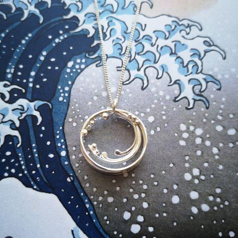 Recycled silver crashing barrel wave circular necklace with silver ball detail, on background of blue, white and grey wave image Textured Layers, Sea Jewelry, Handmade Silver Jewellery, Ocean Surf, Wave Necklace, Nature Necklace, Katsushika Hokusai, Magical Jewelry, Silver Jewelry Design