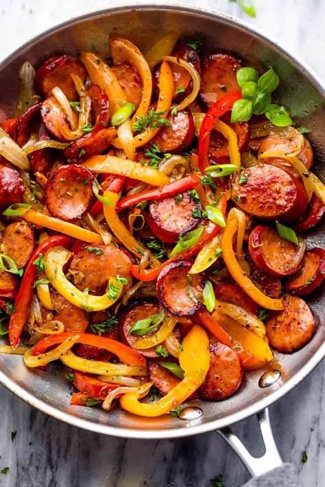 Featuring savory smoked sausage slices, colorful veggies, and a rich medley of herbs and spices, this Smoked Sausage and Peppers Skillet is the ultimate quick dinner everyone will love! Chicken Sausage And Peppers Skillet, Italian Sausage With Peppers And Onions Easy Recipes, Onions Peppers And Sausage, Sauteed Sausage And Peppers Onions, Peppers Onions And Sausage, Peppers And Onions Sausage, Sausage And Onions Recipes, Smoked Sausage Stir Fry Recipe, Sausage Green Peppers And Onions