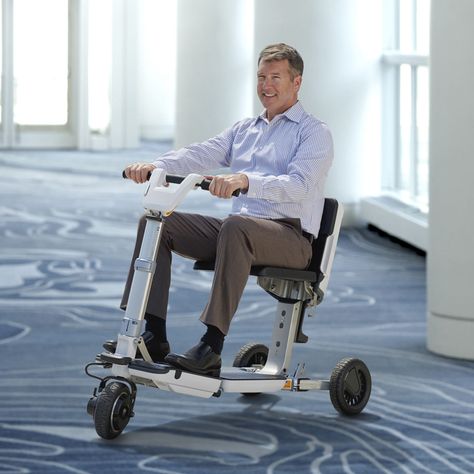 The Traveler's Folding Electric Scooter - Hammacher Schlemmer Yoga Poses For Back, Power Scooter, Best Electric Scooter, Folding Mobility Scooter, Hammacher Schlemmer, Mobility Scooters, Extension Cords, 3d Printed Metal, Get Stronger