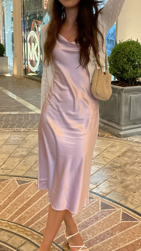 Silk dress with a crochet bag and claw clip in Los Angeles Pink Silk Long Dress, Dress Outfits For Birthday, Aesthetic Birthday Party Outfits, Pink Dress For Graduation, Pastel Silk Dress, Pink Silk Midi Dress, Silk Dress Hoco, Prom Dress With Cardigan, Pale Pink Dress Outfit