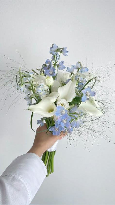 White & blue bridal bouquet Check more at https://beautyfashionideas.com/bridal/white-blue-bridal-bouquet-2/ Blue Flowers Bouquet Wedding, Light Blue Flower Bouquet Wedding, White Lily Bridal Bouquet, Simple Blue Bouquet, Wedding Bouquets Light Blue, All White Florals Wedding, Blue Bridal Bouquet Real Flowers, Bridesmaid Bouquet Blue And White, Blue Flower Wedding Bouquet