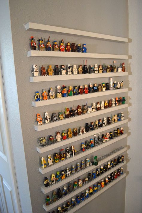 Very cool!!! However, it would probably be easier and safer for the wall to create the shelving as one piece vs individual shelves as it appears here.                           * think smarter, not harder * Lego Shelf, Lego Bedroom, Lego Organization, Lego Display, Lego Room, Lego Storage, Lego Minifigure, Kids Room Wall, Toy Rooms