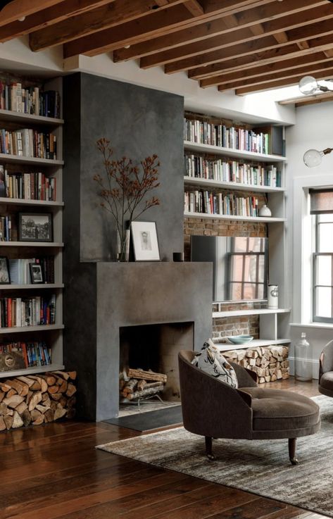 // m e t a l Books Next To Fireplace, Fireplace Architectural Digest, Half Wall Faux Fireplace, Dark Area Rug Living Room, Mid Century French Country, Home Interior Design Dark Floor, Architectural Digest Kitchens, Living Room Library Fireplace, Town House Interior Design Ideas