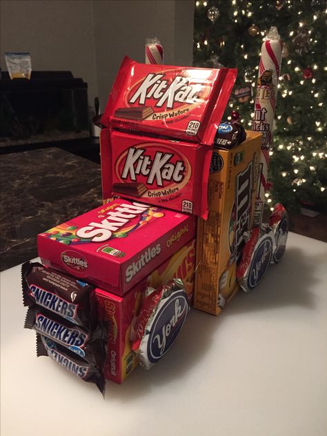 Semi truck made of candy. Dollar store candy boxes and candy canes hot glue gunned together Semi Truck Decorations Ideas, Truck Driver Party Ideas, Driver Appreciation Ideas Truck, Truck Driver Gifts Ideas, Semi Truck Made Out Of Candy, Semi Truck Party, Candy Truck, Christmas Candy Crafts, Desert Party