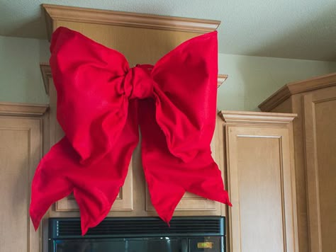 Giant holiday bows are all over Disney Parks during the holiday season. Here's a DIY tutorial that shows you how to make Giant Holiday Bows for your house. Front Door Bow, Deco Mesh Bows, Giants Wreath, Car Bows, Christmas Bows Diy, Door Bow, Giant Bow, Mesh Bows, Christmas Tree Bows