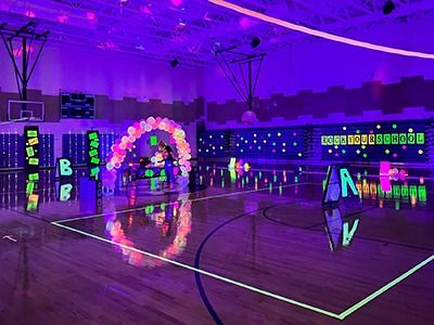 School Glow Events and Fundraisers: Everything You Need - PTO Today Neon Pep Rally Ideas, Glow Pep Rally Ideas, Glow Party Ideas For School Dance, Elementary Glow Dance Party, School Glow Party Ideas, Glow In The Dark Pep Rally Posters, Glow In The Dark Pep Rally Ideas, Glow Dance Party Decorations, Gym Dance Decorations School