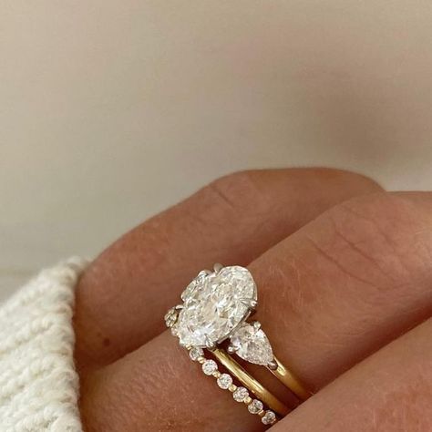 Engagement Right With Wedding Band, Shawn Johnson Wedding Ring, Wedding Band Three Stone Ring, Oval Ring With Diamonds On Side, Three Stone Engagement Ring And Wedding Band, Wedding Bands For Three Stone Rings, Oval Engagement Ring Stacked Bands, Wedding And Engagement Ring Stack, Trilogy Ring Stack