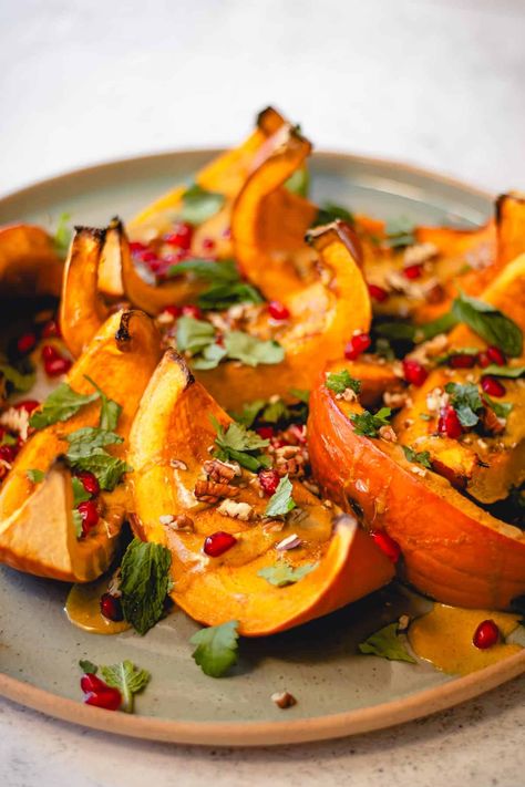 This easy Roasted Pumpkin is the best veggie side dish for fall! Just slice a whole pie pumpkin into wedges and top with tahini sauce and pomegranate for a simple and flavorful plant-based side dish. This is a great way to use up extra pumpkins you've been decorating with for Halloween, and it'd be a perfect recipe for Thanksgiving, too! Pumpkin Wedges Recipes, Savoury Pumpkin Pie, Savoury Pumpkin Recipes, Pumpkin Side Dish Recipes, Pumpkin Side Dish, Pumpkin Brunch, Oven Roasted Pumpkin, Thanksgiving Pumpkin Recipes, Pumpkin Slices