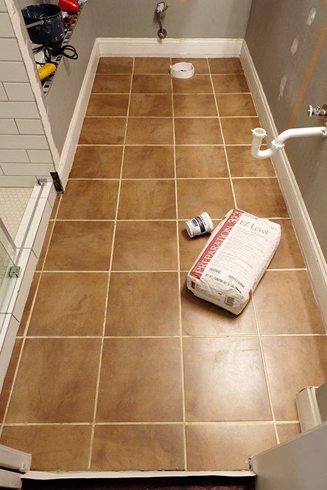 Looking to learn, experiment, and erase a tile floor quick, self-leveling concrete and brass inlays were the weapons of choice. So I finally finished redoing the master shower, right, so ugh, the floor was that much more noticeably awkward and unattractive. It had to go! And go now! But I was so tired of tiling....hm. What to do?I'll try some self-leveling concrete underlayment! Before I get too far into this, I should say that yes, I am aware this product is underlayment and n Concrete Tile Bathroom, Diy Concrete Tiles, Bathroom Concrete Floor, Tile Over Tile, Cement Bathroom Floor, Concrete Floors Diy, Cement Bathroom, Concrete Shower, Concrete Bathroom