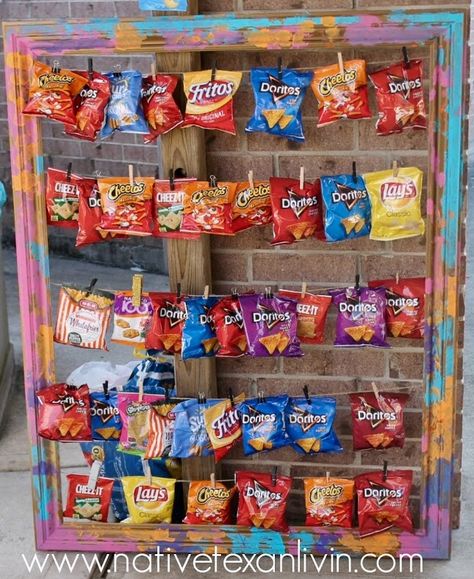 DIY Chip Bag Display -  Paint an empty wooden frame. Staple twine to the back of frame. Add clothespin and chips. Chips At A Party, Party Stations, Mexican Birthday Parties, Village Fete, Empty Frame, Bbq Table, Mexican Birthday, Outdoor Cinema, Mexican Party Theme