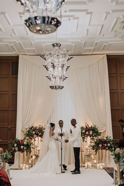 Drape Ceremony Backdrop, All White Wedding Ceremony Indoor, Wedding Ceremony Backdrop Design, Wedding Backdrop With Candles, Ballroom Ceremony Decor, Ballroom Wedding Backdrop, Wedding Alter Without Arch, Wedding Backdrop Drapes, Indoor Wedding Ceremony Flowers