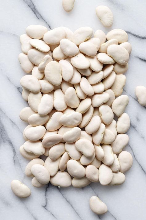 Dried lima beans are a pantry staple. Here's how to cook them! Dried Lima Beans, Beans Aesthetic, Vegan Bean Soup, Brothy Beans, Bean Soups, Vegan Bean, Dried Bay Leaves, Vegan Beans, Parmesan Rind