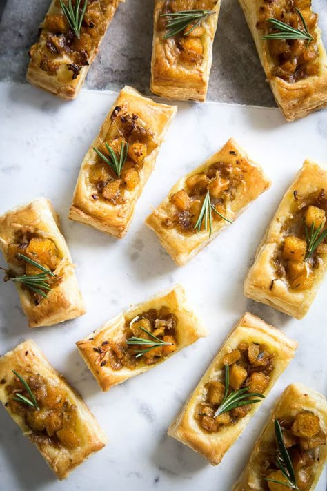 These Pumpkin & Rosemary Puff Pastry Bites are incredibly easy to pull together and make for the perfect bite-sized fall appetizer. Savory Fall Pastries, Fall Small Bites, Thanksgiving Appetizers Puff Pastry, Fall Party Hourderves, Savory Pumpkin Appetizers, Vegan Holiday Appetizers Christmas, Pumpkin Pastry Recipes, Fall Bite Size Desserts, Pumpkin Puff Pastry Desserts