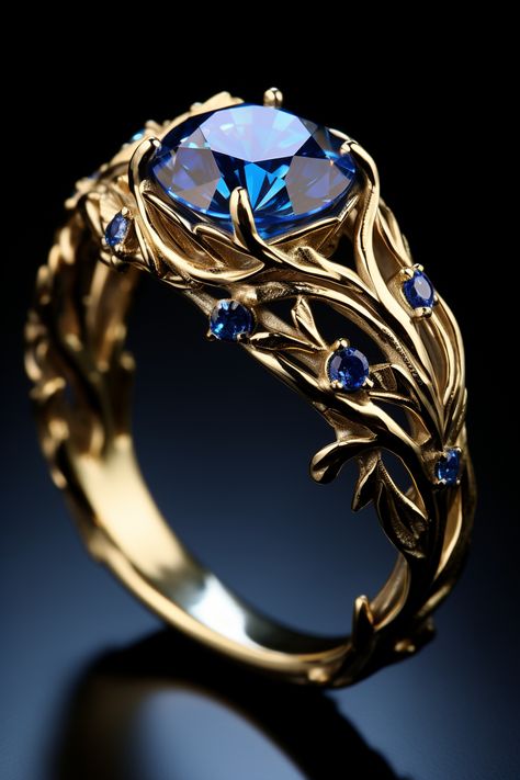 a gold ring with one big blue stone and a few smaller blue stones Fantasy Wedding Rings, Fantasy Jewelry Magic, Diy Wire Jewelry Rings, Blue Wedding Rings, Pretty Engagement Rings, Diamond Fashion Jewelry, Cute Engagement Rings, Blue Ring, Magical Jewelry