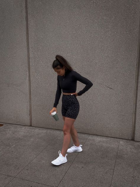 Woman in black athletic wear and white tennis shoes is holding a coffee somewhere in the city. Photo has a low exposure aesthetic making white shoes pop. Shoes are curated on LTK. Click link to shop. White Running Shoes Outfit, White Gym Shoes, White Tennis Shoes Outfit, Athletic Shoes Outfit, White Shoes Outfit, White Athletic Shoes, White Gym, Outfit Inspo Aesthetic, Tennis Shoes Outfit