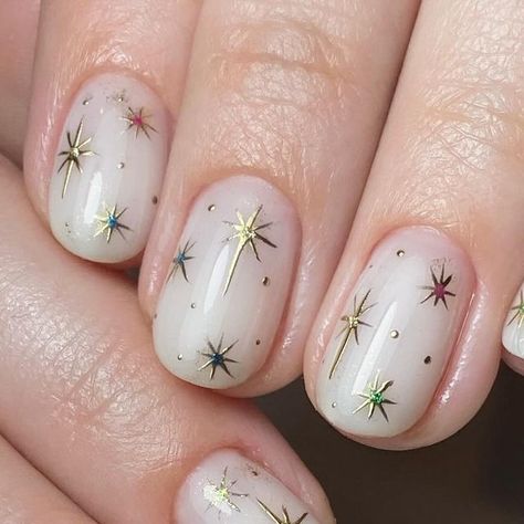 @ashley_thatnailbabe on Instagram: "Twinkle twinkle little star…. ✨🌙  Prep |  @officialnavyprofessional  @willowacademy_lj   Created using | @the_gelbottle_inc   Topped with @lunuluxe | Velvet Bloom  #nails #nailtech #buildergel #thegelbottleinc #navyprotools #nailart #naturalnails #buildergel #handdrawnnailart #naileditbyashley #ilovemyjob #nailsuite #nailsofinstagram #navyprotools #naileditbyashley #nailroom #nailedit #britishmanicure #navytools #navyprep #nailsmagazine #nailpromagazine" Short Nails Celestial, Short Nails Nye, Bethlehem Star Nail Art, Gold Star Nails Short, Silver And Gold Star Nails, Christmas Nails Star Of Bethlehem, Gold Flecks Nails, New Years Star Nails, Bethlehem Star Nails