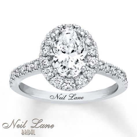 From the Neil Lane Bridal® collection, this breathtaking engagement ring combines classic and modern styles with a dazzling 1 1/2-carat oval-shaped diamond center haloed by round diamonds. The polished 14K white gold band sparkles with more round diamonds, bringing the total weight of the ring to 2 1/8 carats. Neil Lane's signature appears inside the band. Diamond Total Carat Weight may range from 2.115 - 2.14 carats. Neil Lane Engagement Rings, Neil Lane, Engagement Ring Guide, Bridesmaid Jewelry Sets, White Gold Band, Halo Engagement Rings, Gold Engagement, Unique Engagement Rings, Diamond Stone