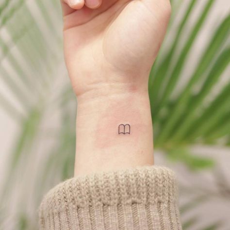 Book Tok Tattoo, Tiny Book Tatoos, Bookish Minimalist Tattoo, Book Stick And Poke Tattoo, Small Book Stack Tattoo, Book Micro Tattoo, Small Book Related Tattoos, Micro Book Tattoo, Small Book Inspired Tattoos