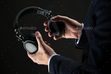 close up of businessman hands holding headphones by dolgachov. technology, people and business concept – close up of businessman hands holding headphones over black background Photo Mobile, Hand Photography, Technology Photos, Hands Holding, Business Concept, Mobile Learning, Happy Friends, Business Communication, Business People