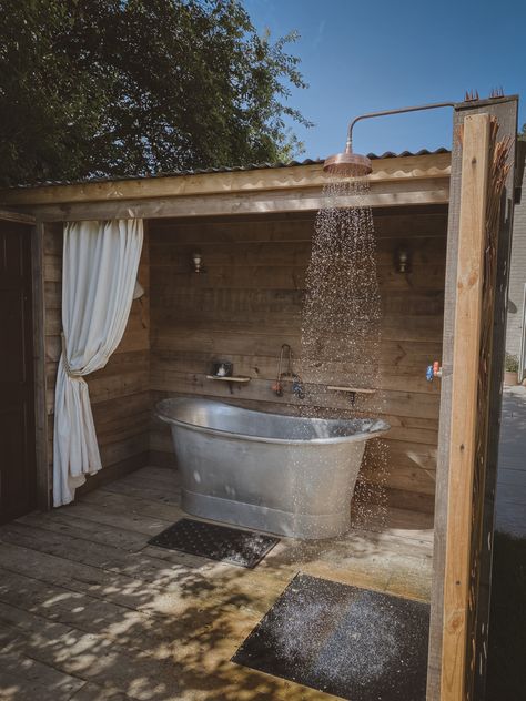 We built a bath cabin from reclaimed materials and installed a lucrious double ended tin bath and an copper shower Diy Outdoor Bathhouse, Outside Bathtub Ideas, Patio Bathtub, Rustic Outdoor Bathroom Ideas, Outdoor Shower Aesthetic, Outdoor Shower Ideas Private, Outdoor Bath House, Outside Bathtub, Outside Bathroom