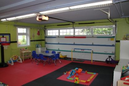 Garage Into Playroom, Painted Playroom, Playroom Garage, Amazing Playroom, Kids Garage, Opening A Daycare, In Home Childcare, At Home Daycare, Garage Playroom