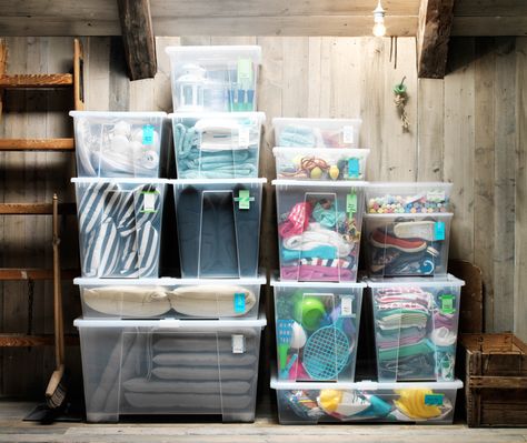 See-through storage boxes filled with clothing and toys piled up in an orderly manner against an attic wall. Ikea Storage Bins, Ikea Samla, House Closet, Ikea Usa, Casa Clean, Ikea Website, How To Store Shoes, Ikea Storage, Reading Corner