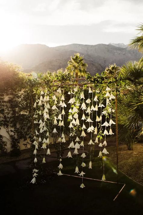 Get inventive with your wedding arch with suspended strands of florals. We love that this couple chose to stick with simple white flowers and a gold stand for this classic tropical wedding. Click the link for more stunning wedding ceremony backdrops. // Photo: Tony Wodarck, Design + Planning: After The Engagement, and Florals: The Lavendar Rose Vows For Her, Ocean Flowers, Gary Clark Jr, Gary Clark, Emotional Wedding, Wedding Altars, Wedding Ceremony Backdrop, Wedding Backdrops, Palm Springs Wedding