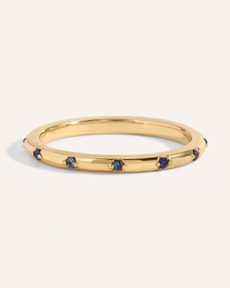 Sister to our Diamond Lucy Band. A fun twist on a traditional gold band with round sapphires spaced evenly all the way around. This .06ct eternity band is a great option for stacking or as wedding band. Band width, 1.7mm *Please note eternity bands cannot be resized. Gold Band With Sapphire, Wedding Band With Sapphire, Lucy Band, Sapphire Band Ring, Colored Wedding Bands, Jewelry Alternative, Blue Wedding Band, Dainty Wedding Band, Sapphire Wedding Band