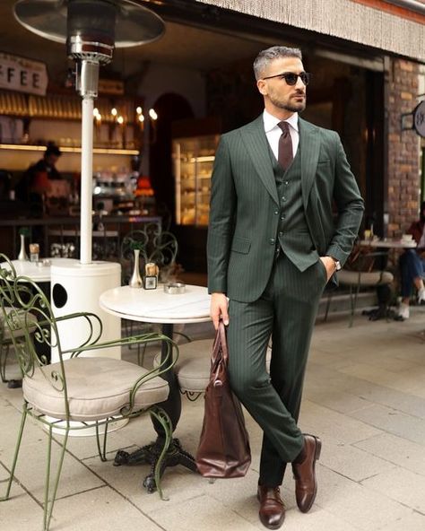 𝐌𝐑𝐆𝐔𝐈𝐋𝐃 on Instagram: "Canary Wharf ✨  Elevate your style with a tailored slim fit forest green three piece pinstripe men’s suit. The pinstripe pattern adds a touch of sophistication to the rich forest green hue, creating a harmonious blend of modern and classic. The peak lapels enhance its timeless appeal, making it ideal for formal events. This ensemble exudes confidence and refinement, allowing you to stand out with a distinctive and sophisticated look. Whether for upscale gatherings or special occasions, this suit showcases your impeccable taste and individuality.  #mrguild #sizebox #groom #wedding #menswear #mensfashion #fashion #menstyle #style #mensstyle #men #streetwear #fashionblogger #streetstyle #menfashion #instafashion #menwithstyle #mensclothing #instagood #model #mens Mens Green Wedding Suit, Forest Green Suit Men, Men Wedding Suits Modern, Forest Green Suits, Green Pinstripe Suit, Modern Suits Men, Men Green Suit, Forest Green Suit, Three Piece Suit Mens