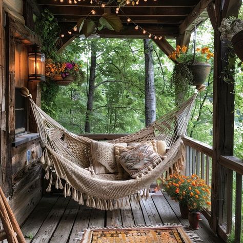 Relaxing outdoor hammock surrounded by hanging flowers and warm lighting, perfect for unwinding in nature. Hammock Front Porch, Porch With Hammock, Porch Hammock, Room Hammock, Net Hammock, Indoor Hammock, Enclosed Porches, Outdoor Aesthetic, Warm Lighting